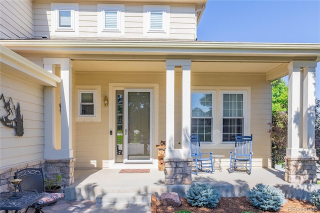 doorway to property featuring a porch