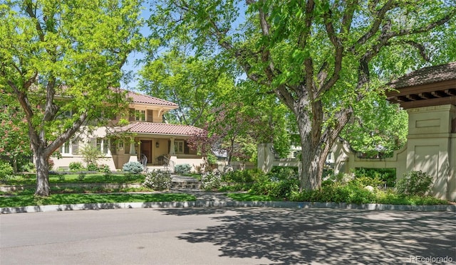 395 N Franklin St, Denver, CO 80218 - view of front of home with a tile roof and stucco siding