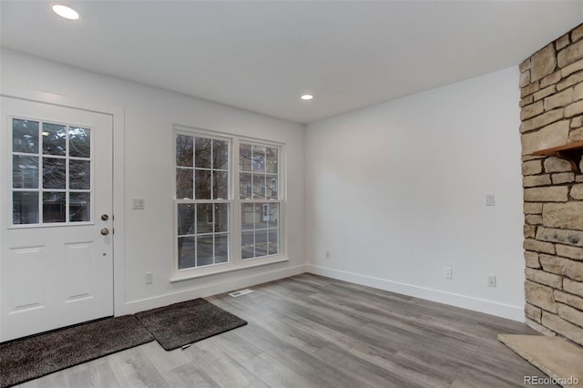 11973 E Kepner Dr, Aurora, CO 80012 - entryway featuring wood finished floors, baseboards, and recessed lighting