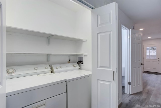 11973 E Kepner Dr, Aurora, CO 80012 - washroom featuring independent washer and dryer, wood finished floors, and recessed lighting