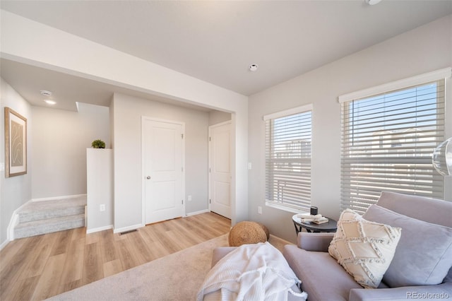 sitting room with light hardwood / wood-style flooring