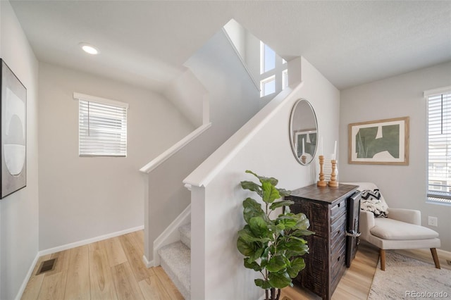 stairs with wood-type flooring