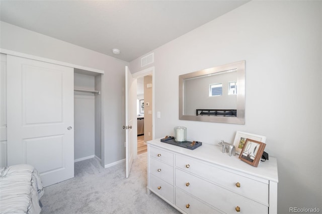 carpeted bedroom featuring a closet