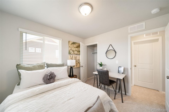 carpeted bedroom featuring a closet