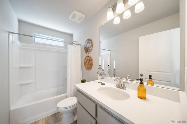 full bathroom with vanity, toilet, wood-type flooring, and shower / bath combo with shower curtain