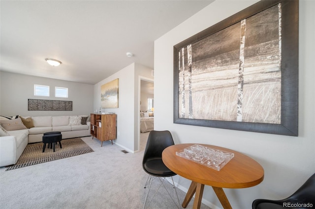 living room featuring light carpet