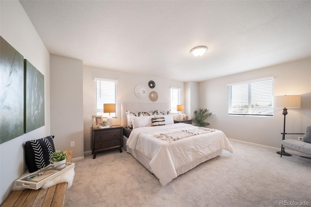 bedroom featuring light colored carpet