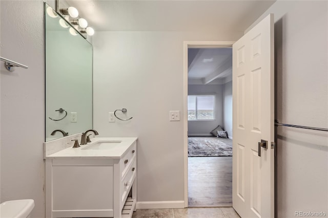 bathroom featuring vanity, toilet, wood-type flooring, and beamed ceiling