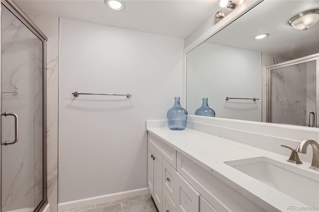 bathroom featuring vanity, walk in shower, and tile patterned flooring