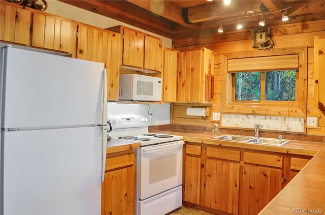 760 Coyote Cir, Black Hawk, CO 80422 - kitchen featuring white appliances, a sink, light countertops, and rail lighting