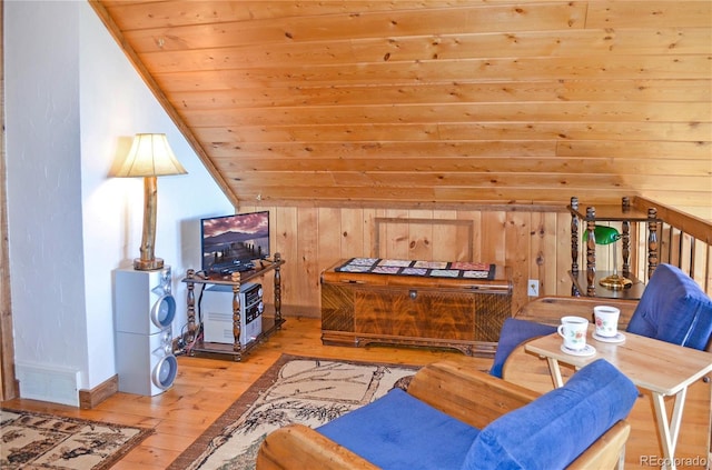 760 Coyote Cir, Black Hawk, CO 80422 - living room with hardwood / wood-style flooring, lofted ceiling, wood ceiling, baseboards, and wood walls