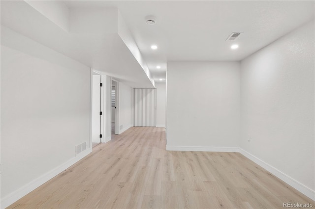 empty room with light hardwood / wood-style floors