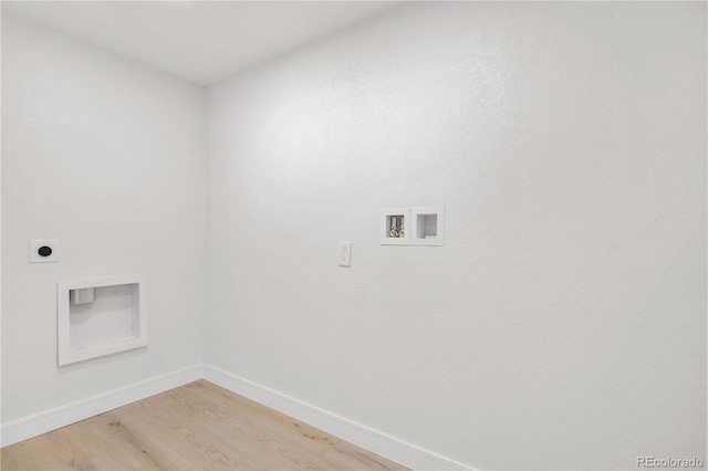 washroom with hardwood / wood-style flooring, washer hookup, and hookup for an electric dryer