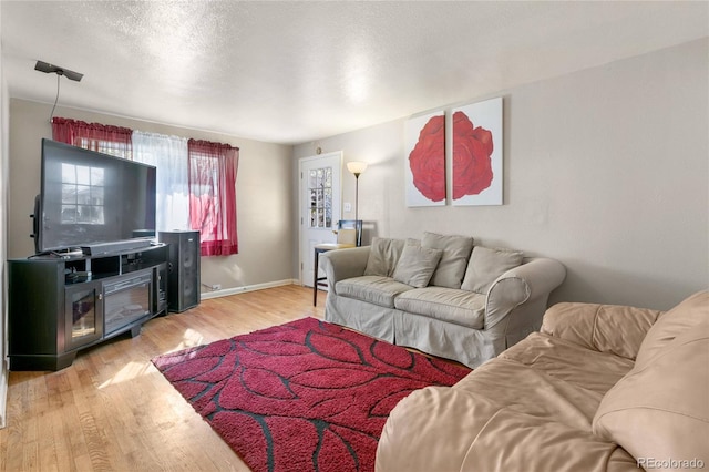 150 S Hooker St, Denver, CO 80219 - living room with light wood finished floors and a textured ceiling