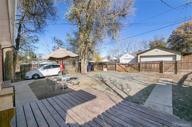 150 S Hooker St, Denver, CO 80219 - wooden terrace featuring a fenced backyard, a garage, and a gate