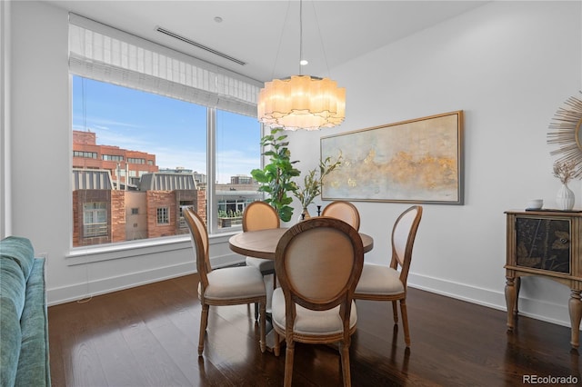 dining space featuring dark hardwood / wood-style flooring