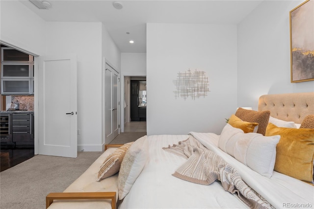 bedroom featuring light colored carpet