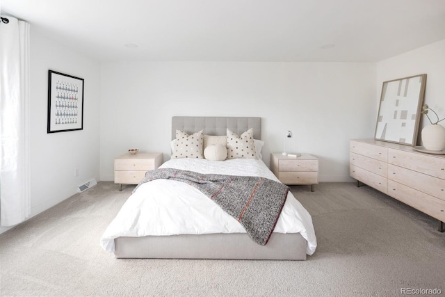 bedroom featuring visible vents and carpet