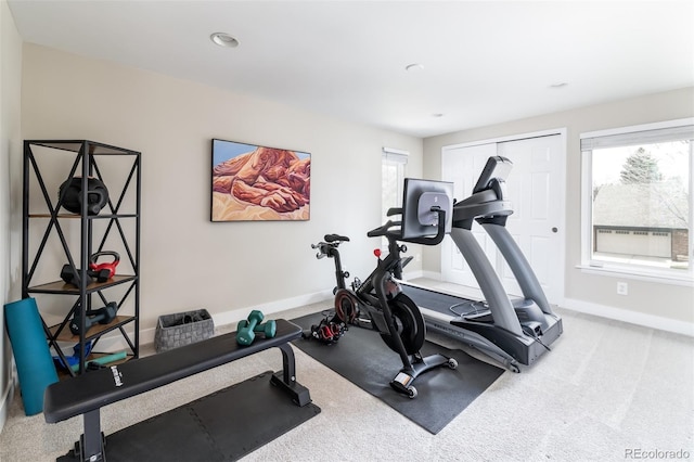 exercise area with plenty of natural light, recessed lighting, baseboards, and carpet floors