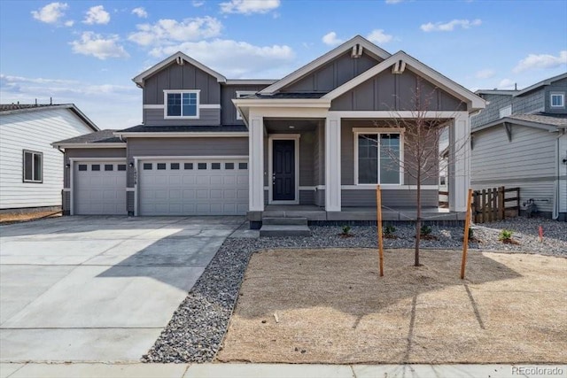 14378 Heritage Dr, Mead, CO 80504 - view of front facade with an attached garage, fence, board and batten siding, concrete driveway, and a porch