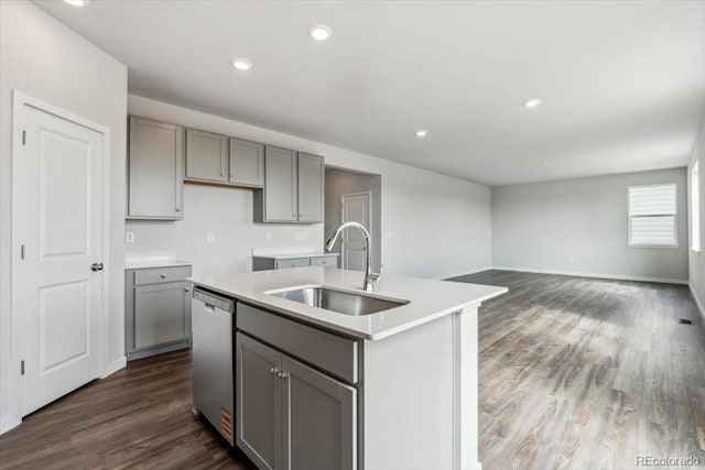 14378 Heritage Dr, Mead, CO 80504 - kitchen featuring stainless steel dishwasher, a sink, gray cabinets, and dark wood-style flooring