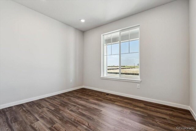 14378 Heritage Dr, Mead, CO 80504 - unfurnished room featuring recessed lighting, baseboards, visible vents, and dark wood-style floors