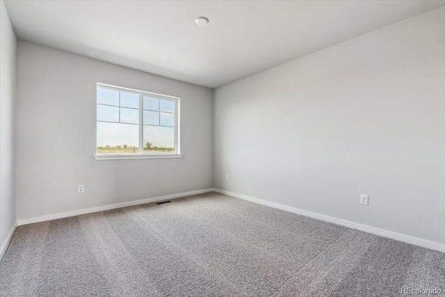 14378 Heritage Dr, Mead, CO 80504 - spare room featuring baseboards and carpet