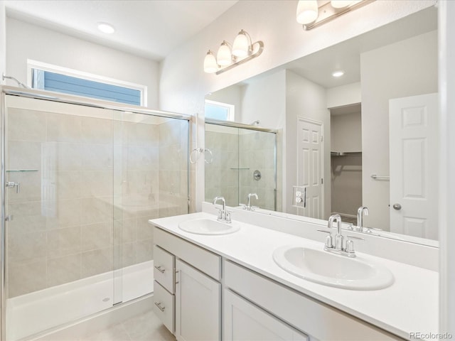 bathroom with walk in shower and vanity