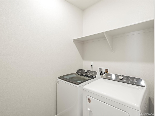 washroom featuring washer and clothes dryer