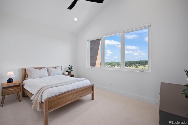 carpeted bedroom with high vaulted ceiling and ceiling fan