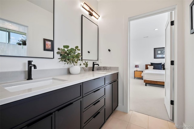 bathroom with tile patterned floors and vanity