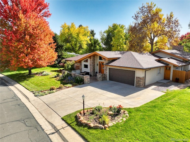 view of front of house with a garage and a front lawn