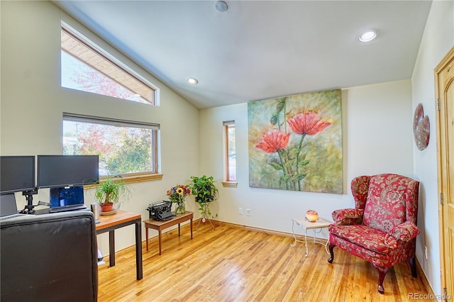 office area featuring light hardwood / wood-style flooring and vaulted ceiling