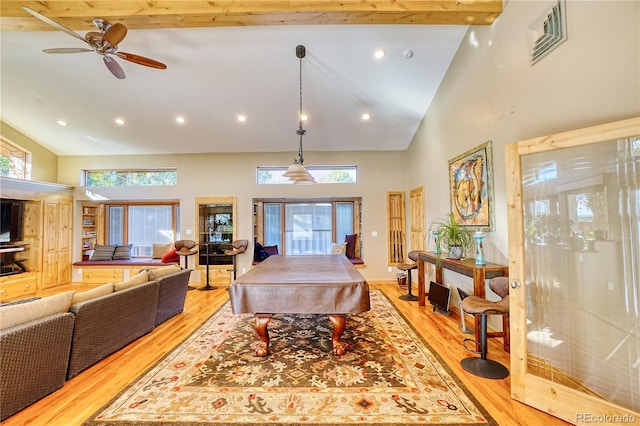 playroom with beamed ceiling, a healthy amount of sunlight, light wood-type flooring, and pool table