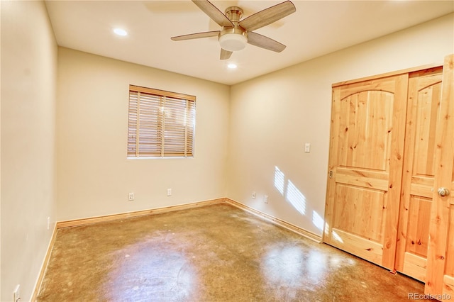 unfurnished bedroom with multiple windows, concrete floors, and ceiling fan