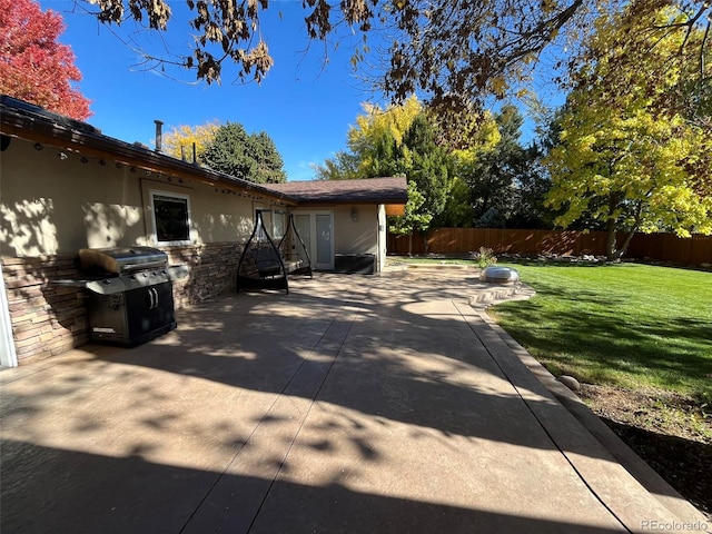 exterior space with a lawn and a patio area