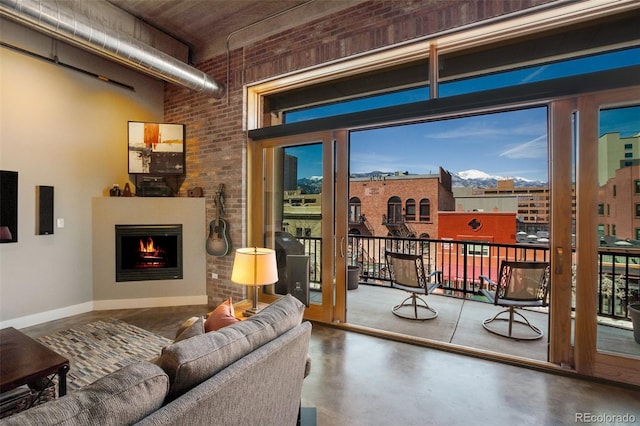 doorway with brick wall and concrete floors