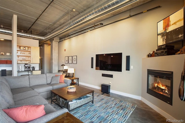 living room with a high ceiling