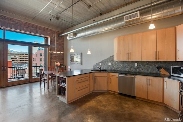 kitchen featuring sink, hanging light fixtures, stainless steel dishwasher, kitchen peninsula, and light brown cabinetry