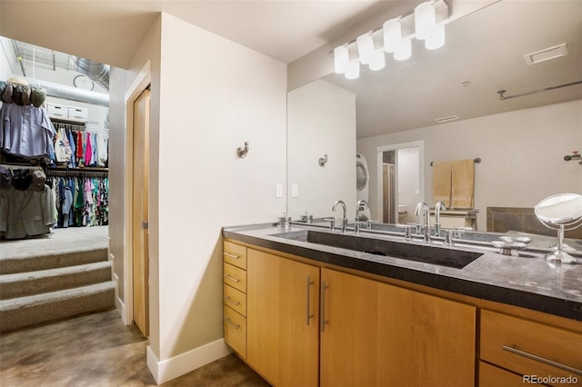 bathroom featuring concrete flooring, vanity, and an enclosed shower