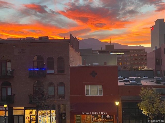 outdoor building at dusk with a mountain view