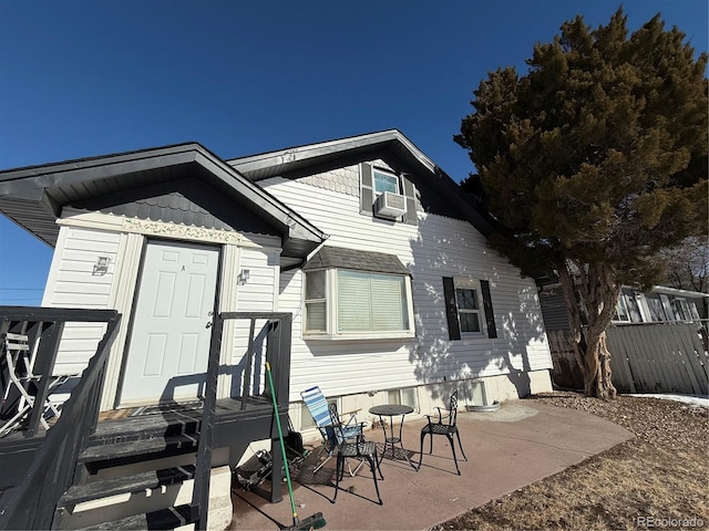 back of property with a patio