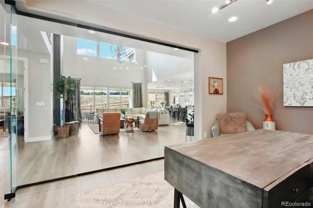 dining room with recessed lighting and wood finished floors