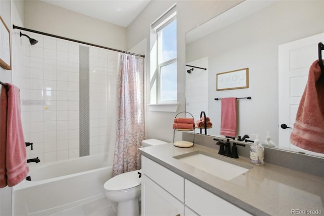 bathroom with vanity, toilet, shower / bath combo with shower curtain, and tile patterned flooring