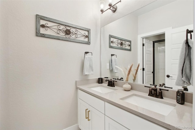 full bath with double vanity and a sink