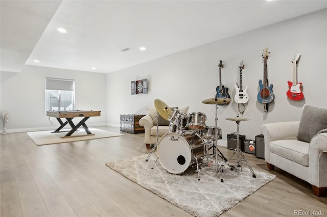 recreation room with recessed lighting, visible vents, baseboards, and wood finished floors