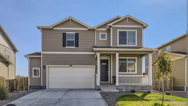 craftsman-style house featuring a porch and a garage