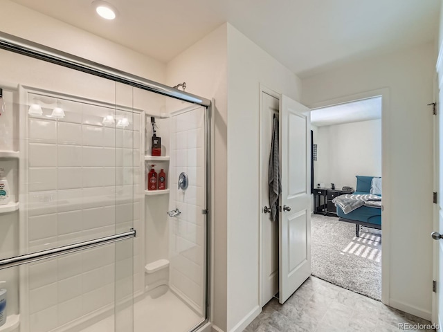 bathroom with a shower with shower door