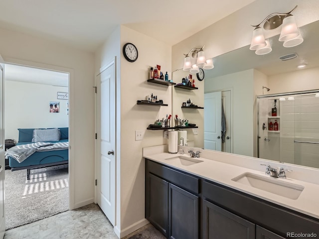 bathroom with vanity and a shower with shower door