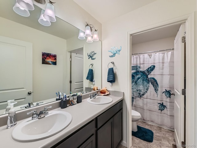 bathroom featuring a shower with shower curtain, vanity, and toilet